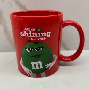 M&M's I'm too Busy Shining to Throw Shade Red Mug Cup Featuring Ms Green Graphic
